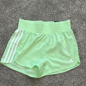 Adidas Light Green Running Shorts with White Stripes, women’s size small